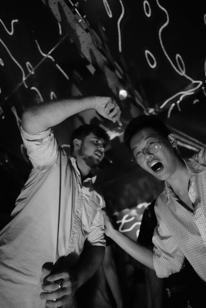 a couple of men standing next to each other